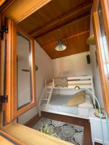 a small bedroom in a tiny house at Refúgio in Castelo de Paiva +50 photos