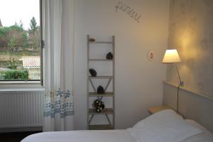 Postel nebo postele na pokoji v ubytování Chambre d'Hôtes de L'Abricotier