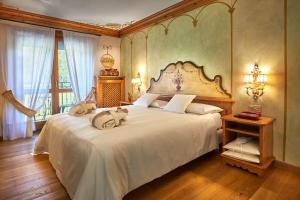 Postel nebo postele na pokoji v ubytování Hotel Miramonti