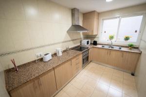 Kuchyň nebo kuchyňský kout v ubytování Apartamento San cayetano