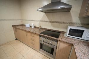 Kuchyň nebo kuchyňský kout v ubytování Apartamento San cayetano