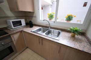 Kuchyň nebo kuchyňský kout v ubytování Apartamento San cayetano