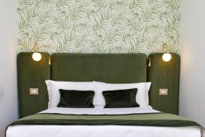 A bed or beds in a room at Home at Rome St. Peter Guest House