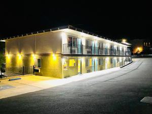 a large building with lights on the side of it at Sierra Inn in San Andreas