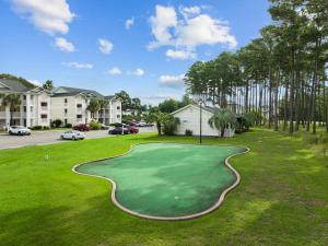 a golf course with a putting green at Fully equipped 2BR 2BA with King Bed in heart of MB in Myrtle Beach