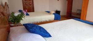 Voodi või voodid majutusasutuse Hotel Sula Sula toas