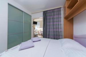 Posteľ alebo postele v izbe v ubytovaní Apartment Joni A2