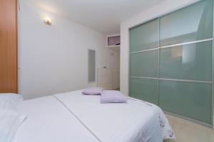 Posteľ alebo postele v izbe v ubytovaní Apartment Joni A2