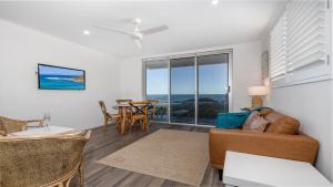 a living room with a couch and a table at Craigmore on the Beach unit 6 in Yamba