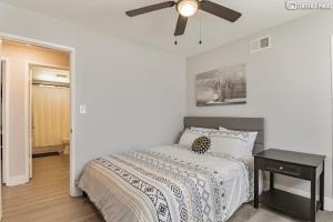 a bedroom with a bed and a ceiling fan at Beautiful 4 bd Mini-Farm Home in Simi with Hot Tub, One Full Bath and One Half Bath in Simi Valley