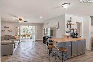 a kitchen and living room with a couch and a table at Beautiful 4 bd Mini-Farm Home in Simi with Hot Tub, One Full Bath and One Half Bath in Simi Valley
