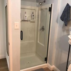 a shower with a glass door in a bathroom at Blue Whale Inn San Clemente Charmer Unit A in San Clemente