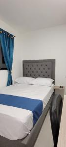 Ένα ή περισσότερα κρεβάτια σε δωμάτιο στο Andaliving Campo Valdes Hospedaje