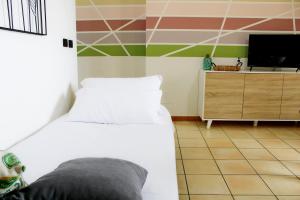 Posteľ alebo postele v izbe v ubytovaní Capo d'Orlando Apartments - Cipria