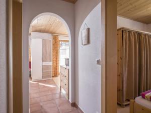 a hallway with an archway in a house at Apartment Erich Brixen in Brixen im Thale