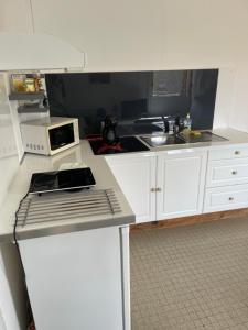 Cucina o angolo cottura di La Colline Business & Tourisme