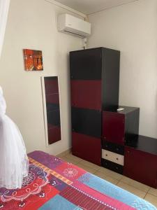 Letto o letti in una camera di La Colline Business & Tourisme