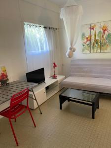 Letto o letti in una camera di La Colline Business & Tourisme
