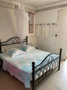 Letto o letti in una camera di La Colline Business & Tourisme