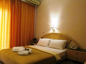 Postel nebo postele na pokoji v ubytování Hotel Lito