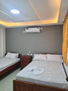 Cama o camas de una habitación en HOSTERIA PUERTO BALBANERA