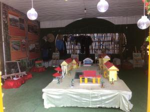 a room with a table with a toy house on it at Thien An Guest House in Yên Minh