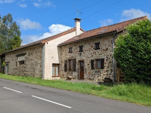 an old stone building on the side of a road at Gîte Massignac, 4 pièces, 6 personnes - FR-1-653-213 in Massignac