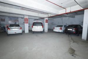 a garage with several cars parked in it at HOTEL K FORT in Jalandhar
