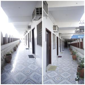 a corridor of a building with a tile floor at HOTEL K FORT in Jalandhar