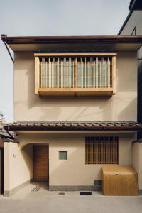 a building with a large organ on the side of it at Yuhi House Kyoto Dog Friendly in Kyoto