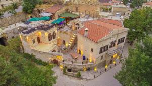 an overhead view of a large house with a red roof at Pietra Cave Suites in Ürgüp