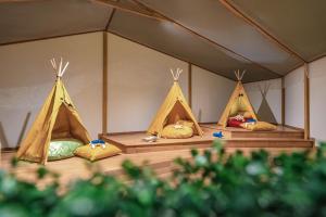 a group of three tents in a room at Regent Phu Quoc in Phú Quốc +143 photos