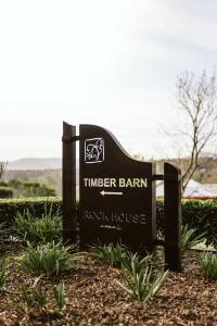 a sign for the tinder barran rock house at Picturesque Barn located on the Shoalhaven River in Nowra