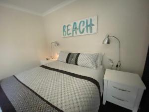 A bed or beds in a room at Middleton Bay Retreat