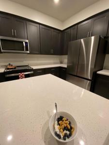 a bowl of fruit on a counter in a kitchen at AZ Chandler Rental in Chandler