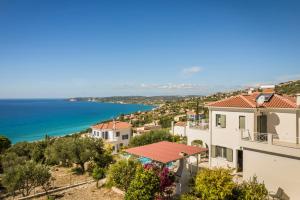 a view of the ocean from a house at Rhakotis Villa in Lourdhata