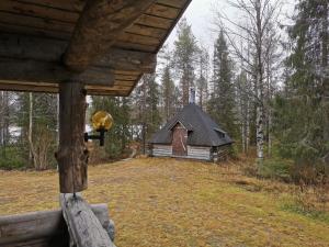 an outside view of a cabin in the woods at Soppela in Syöte