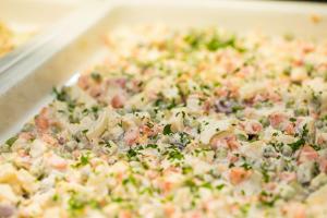 a close up of a pizza with different toppings at Hotel Dražica - Hotel Resort Dražica in Krk
