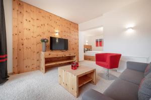 TV a/nebo společenská místnost v ubytování Alpen-Comfort-Hotel Central
