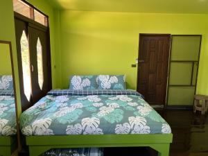 Postel nebo postele na pokoji v ubytování Sukhothai City Resort