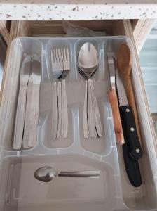 a drawer with utensils in it with a drawer at Larsens Suit Hotel in Alanya