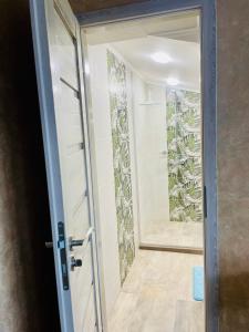 a door leading into a bathroom with a mirror at PANORAMA-М in Vratsa +79 photos