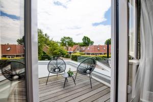Ein Balkon oder eine Terrasse in der Unterkunft Van Heeckeren Hotel