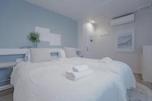 Rúm í herbergi á Asakusa Designer Hotel YOSHII