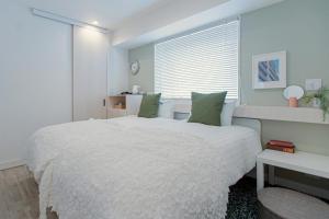 Rúm í herbergi á Asakusa Designer Hotel YOSHII