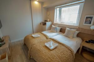 Rúm í herbergi á Asakusa Designer Hotel YOSHII