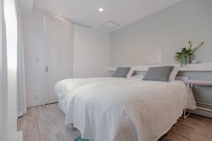 Rúm í herbergi á Asakusa Designer Hotel YOSHII