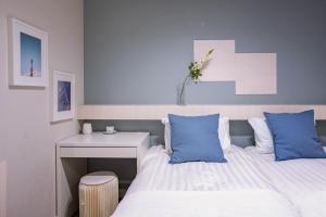 Rúm í herbergi á Asakusa Designer Hotel YOSHII