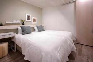 Rúm í herbergi á Asakusa Designer Hotel YOSHII
