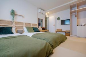 Rúm í herbergi á Asakusa Designer Hotel YOSHII